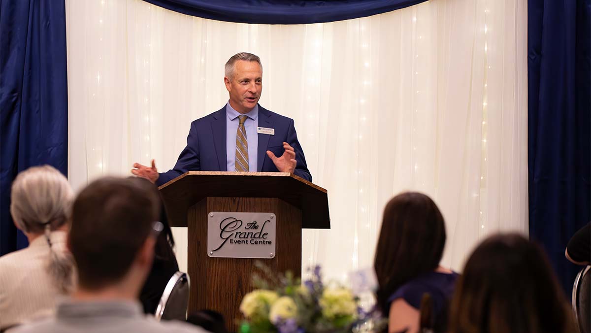 Nipissing University President Kevin Wamsley addresses crowd