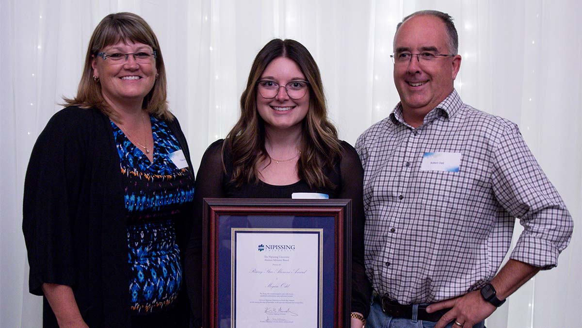 Megan Odd Rising Star Alumni Award winner with family