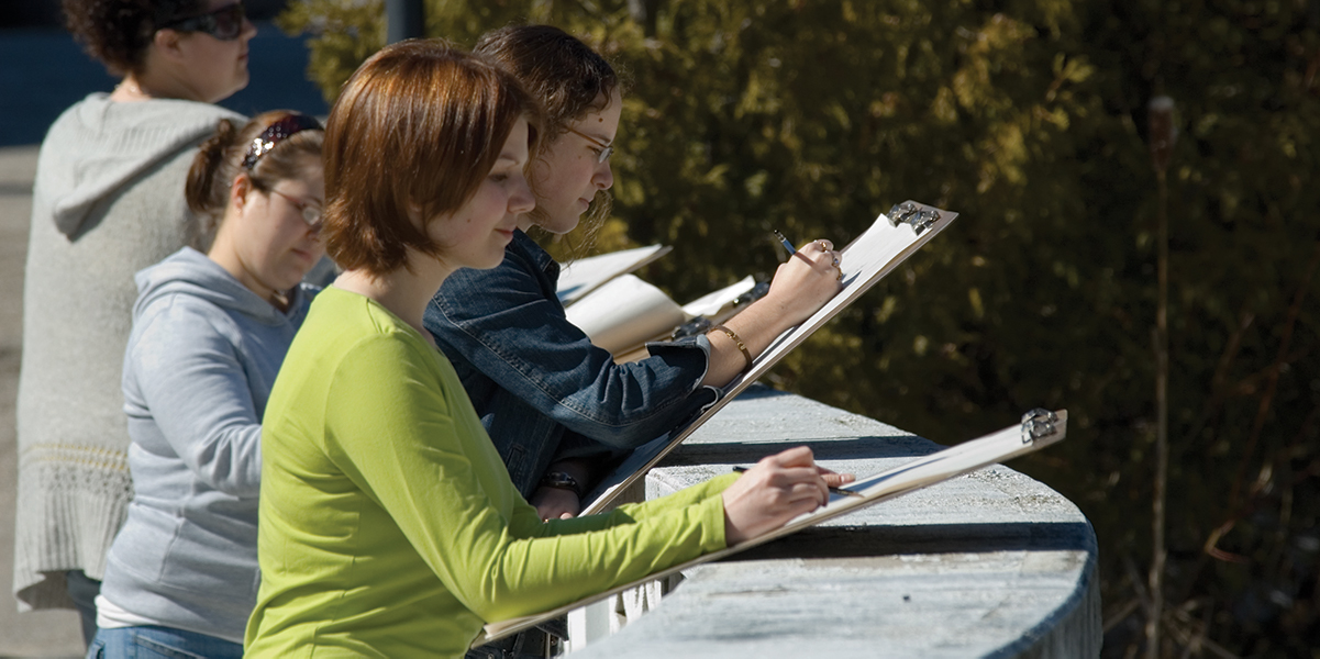 students painting outside