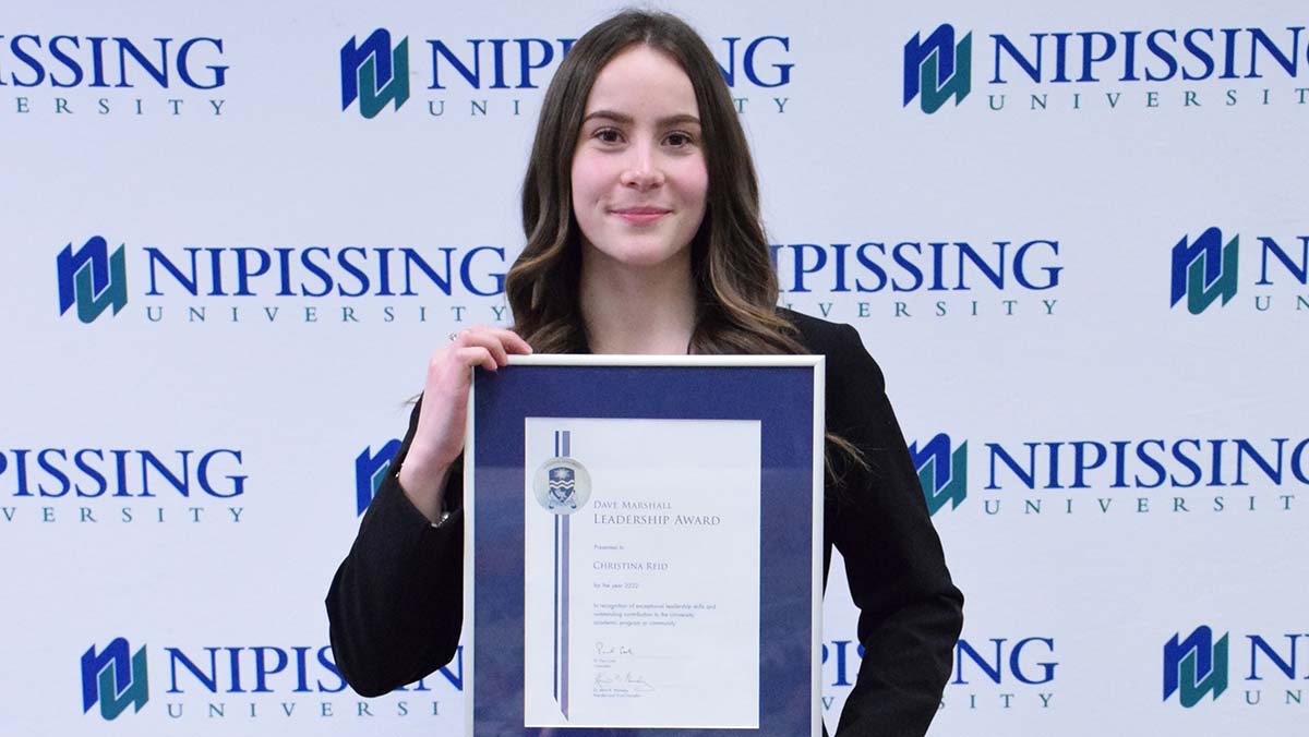 Christina Reid with award