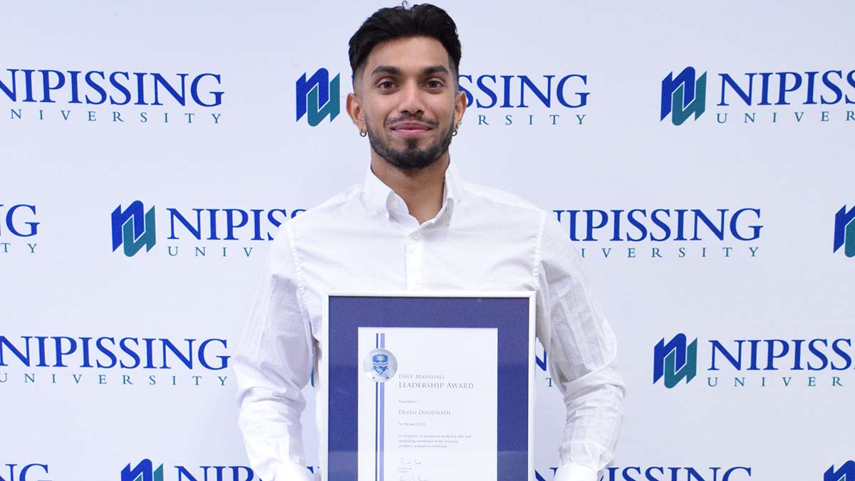 Deven Doodnath with award