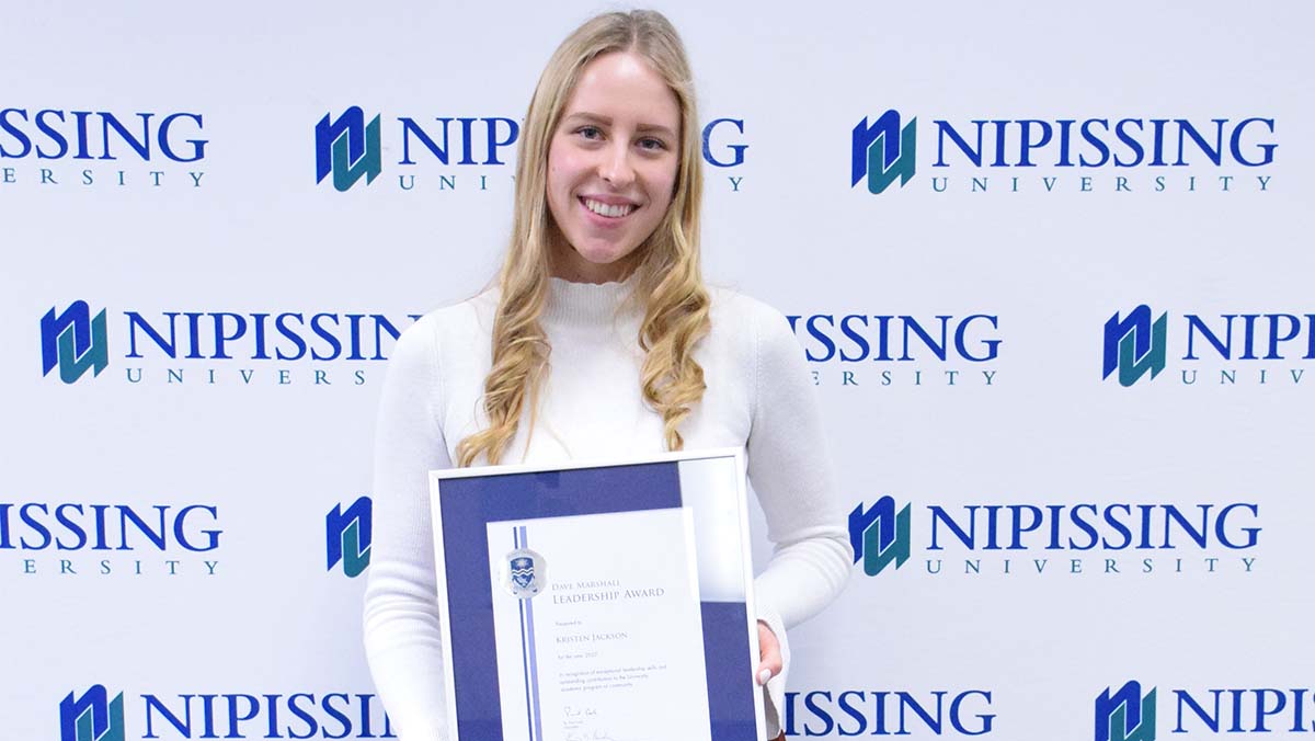 Kristen Jackson with award
