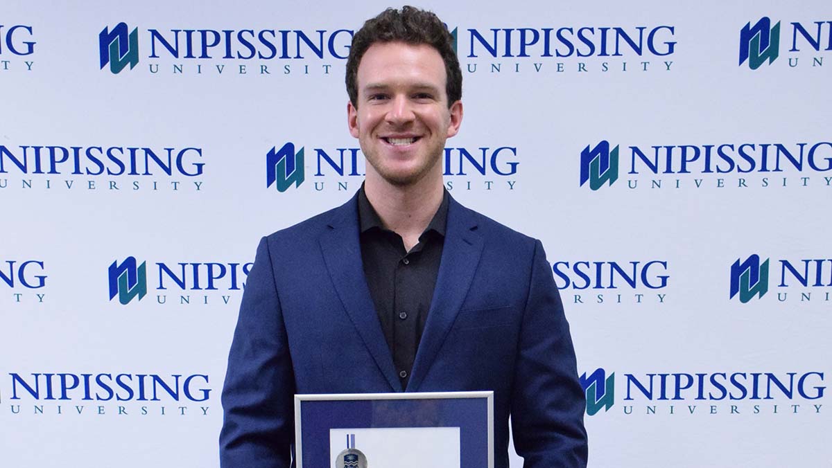 Nicholas Hoey with award