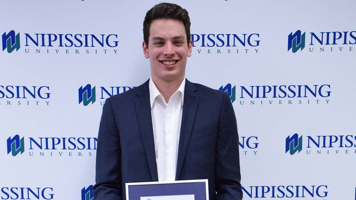 Randy Beauchamp with award