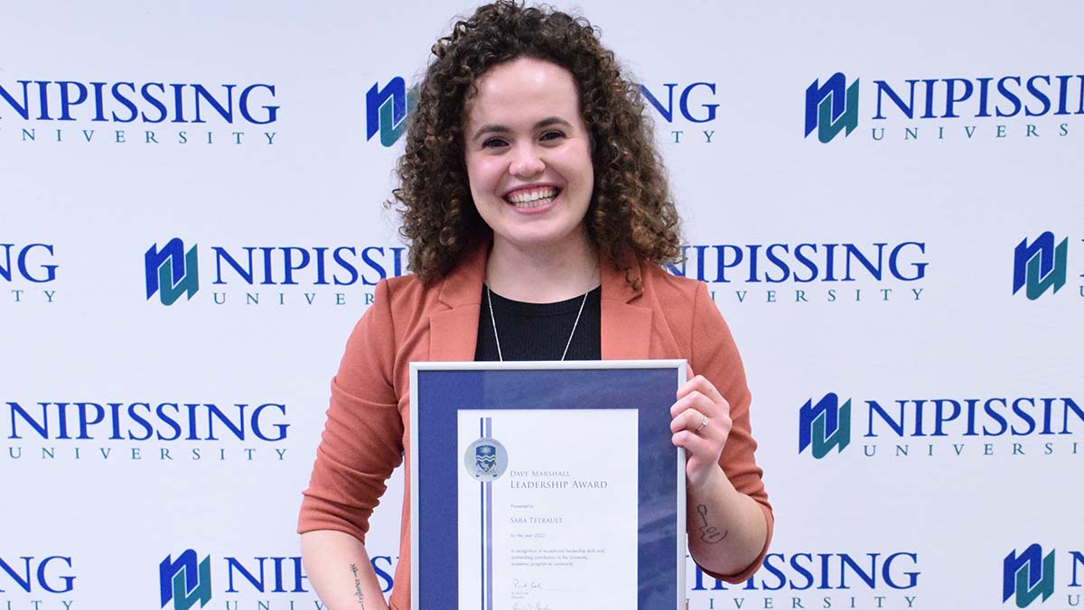 Sara Tetrault with award