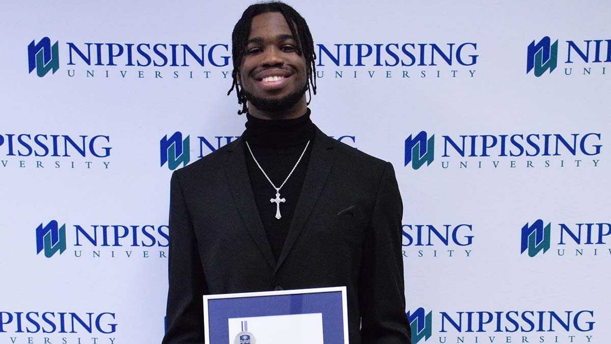 Taijon Eccleston-Graham with award