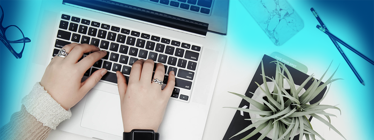A student typing on a laptop