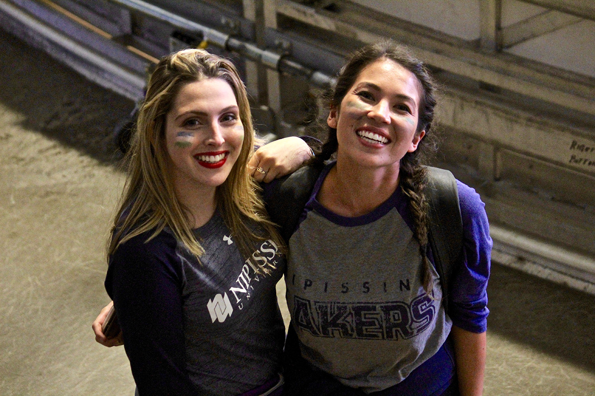 Two people at Hockey game