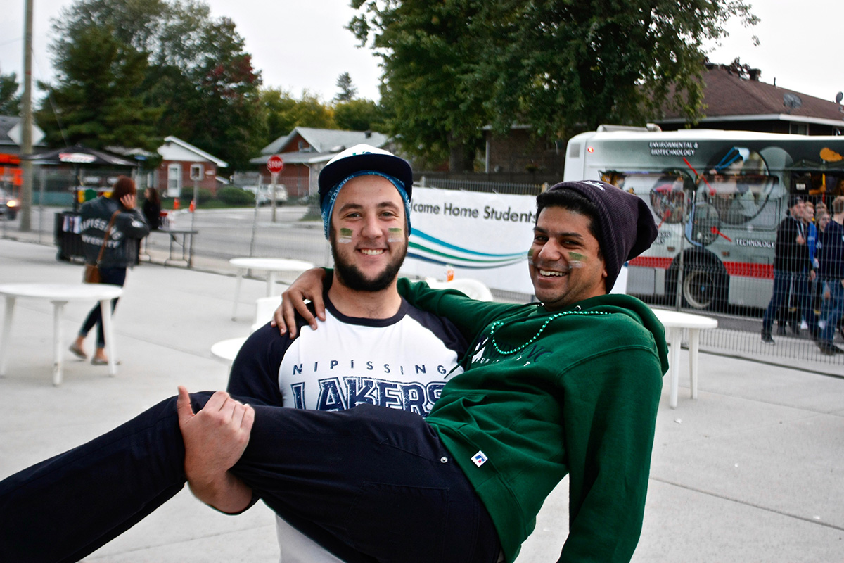 Two people outside Hockey game