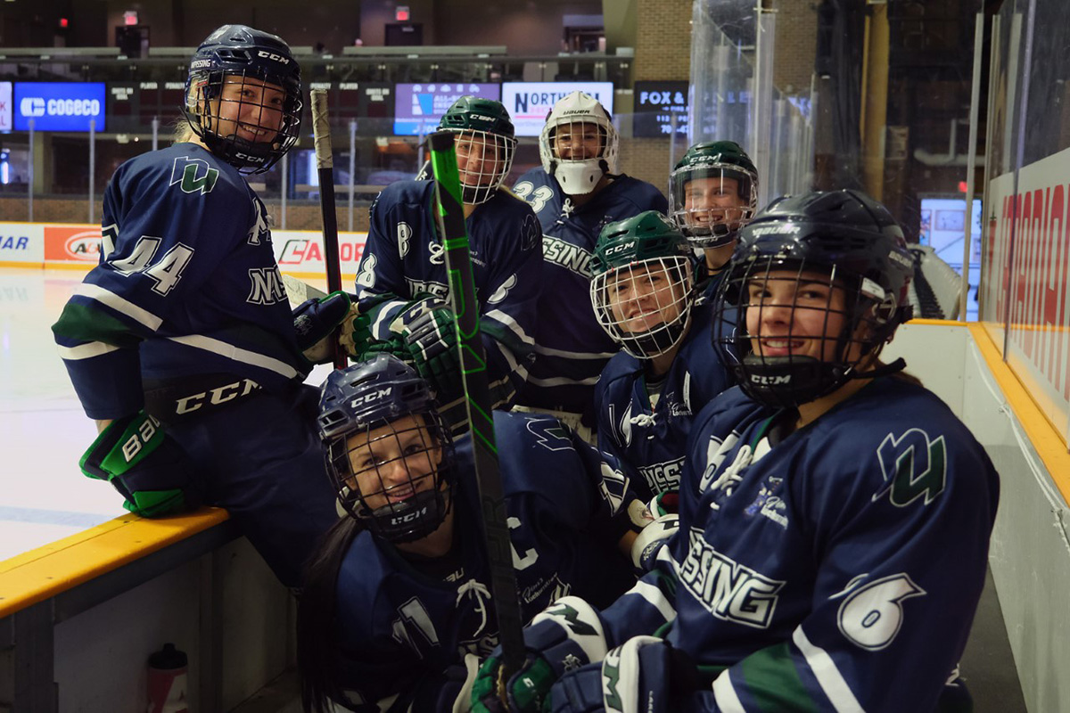 Women's Hockey team on bench