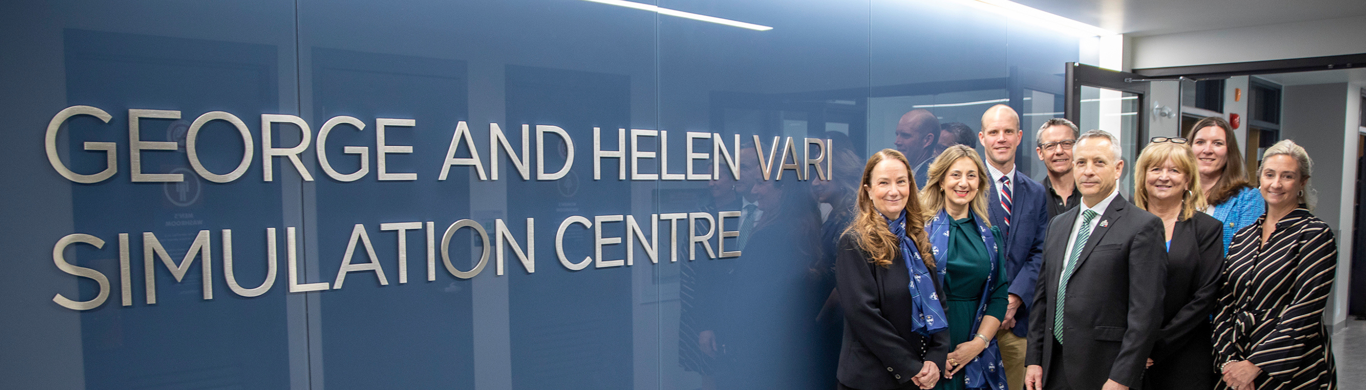 Group photo in front of George and Helen Vari Simulation Centre