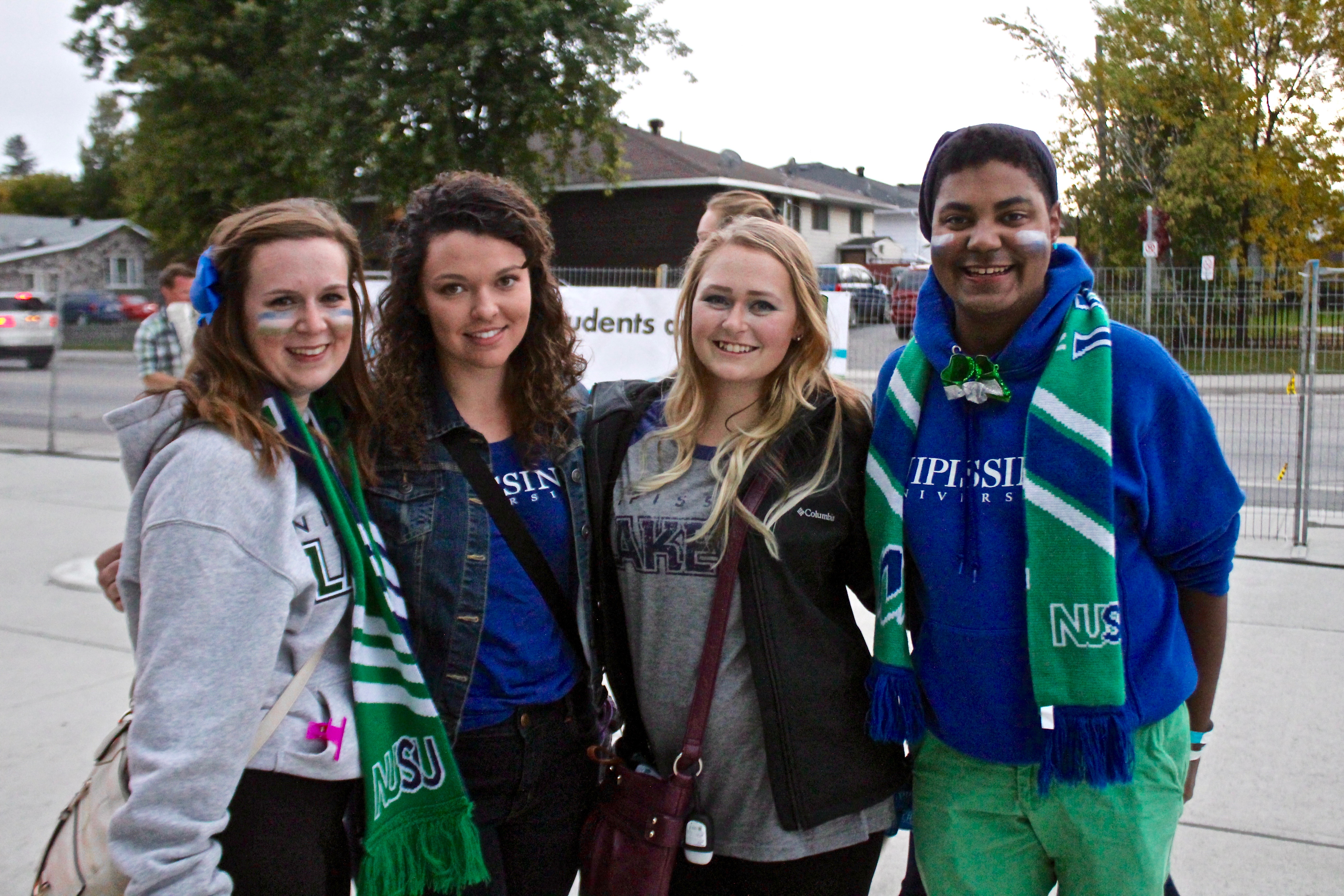 Students outside Memorial Gardens at Homecoming