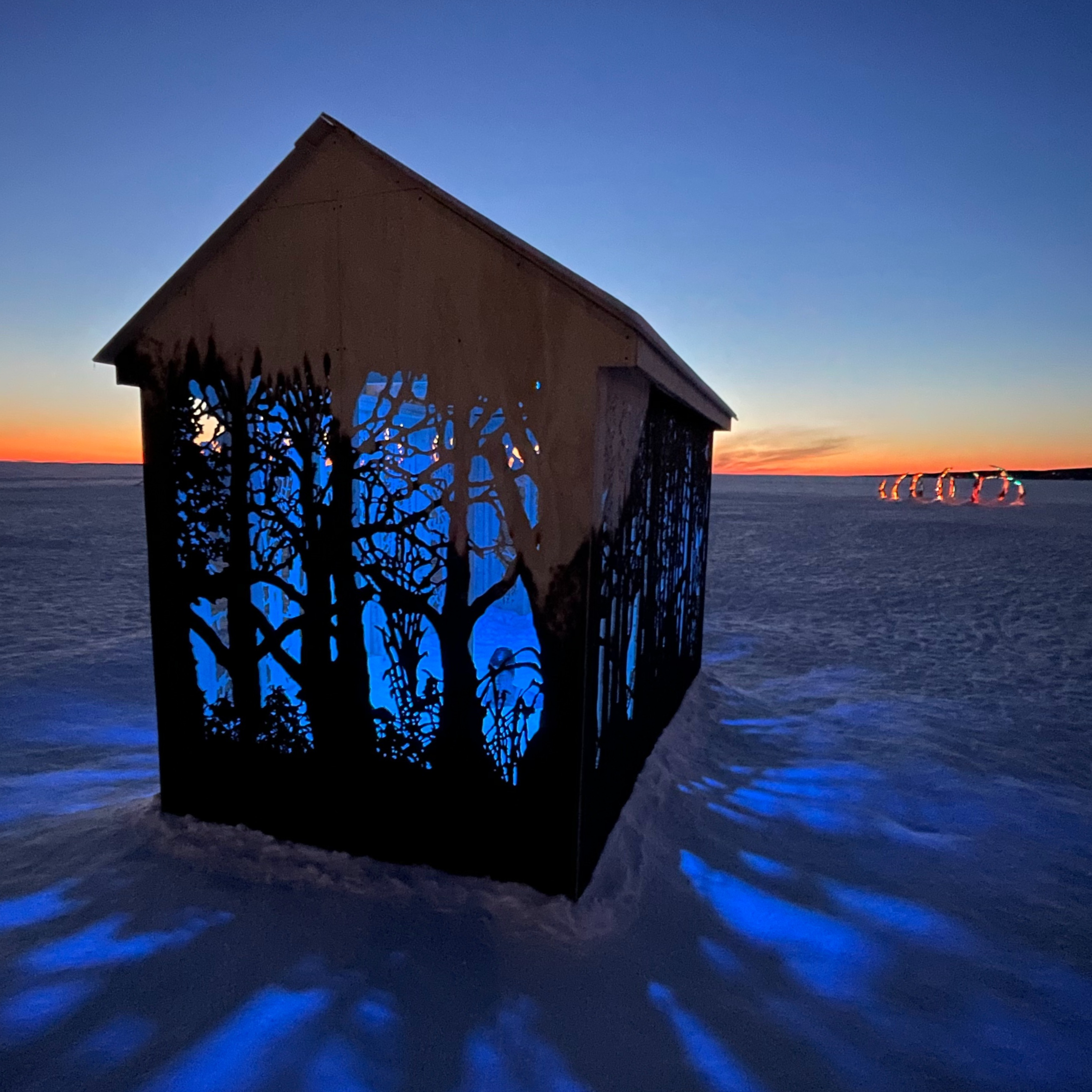 Glowing house with sunset in background