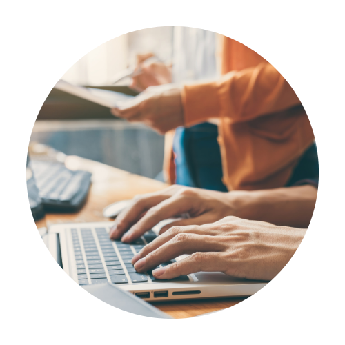 Individual working on a laptop pursuing professional development.