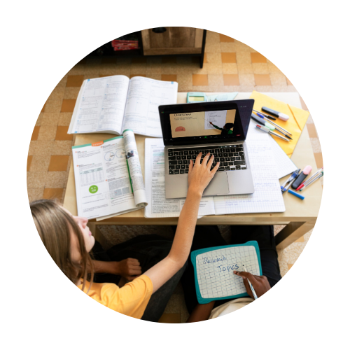 Two individuals working on developing course materials for students.