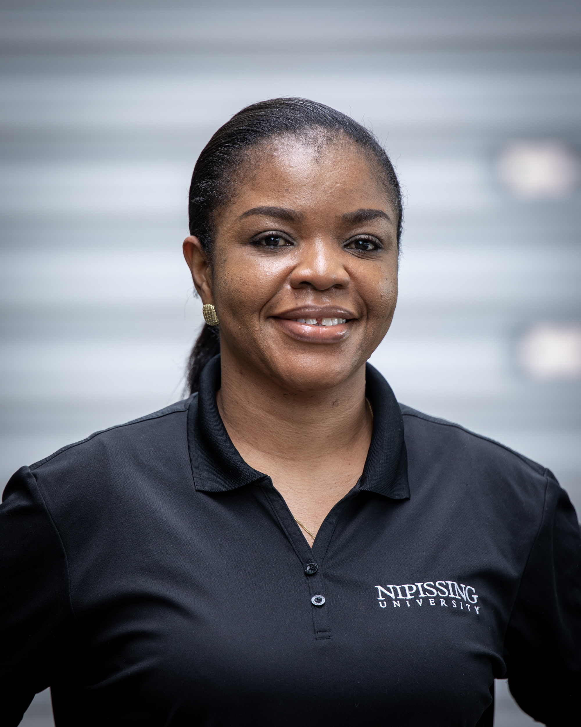 Image of Student Orientation Assistant in black Nipissing University polo shirt