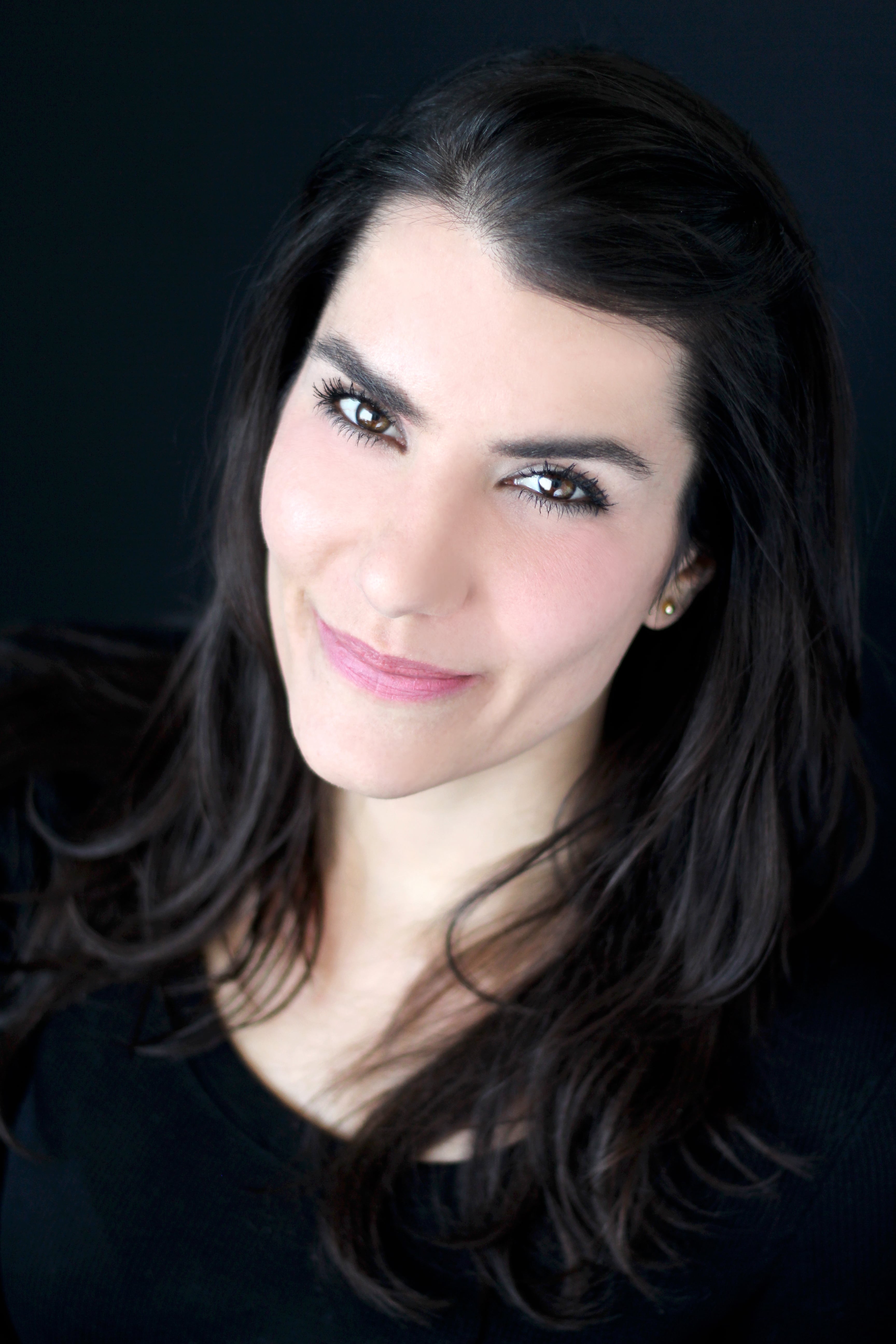 Shawna Partridge from the shoulder up against a black background