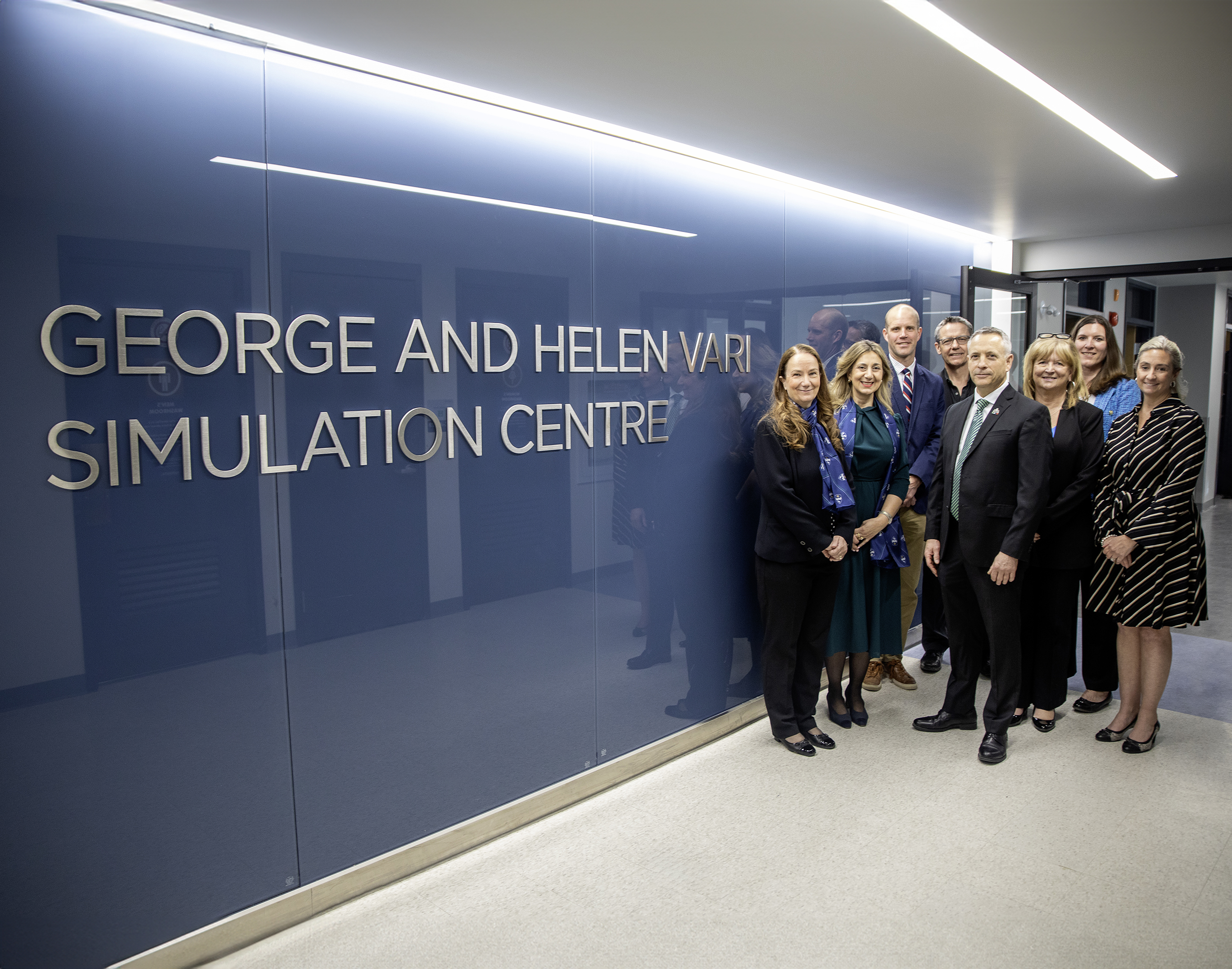Group photo in front of George and Helen Vari Simulation Centre