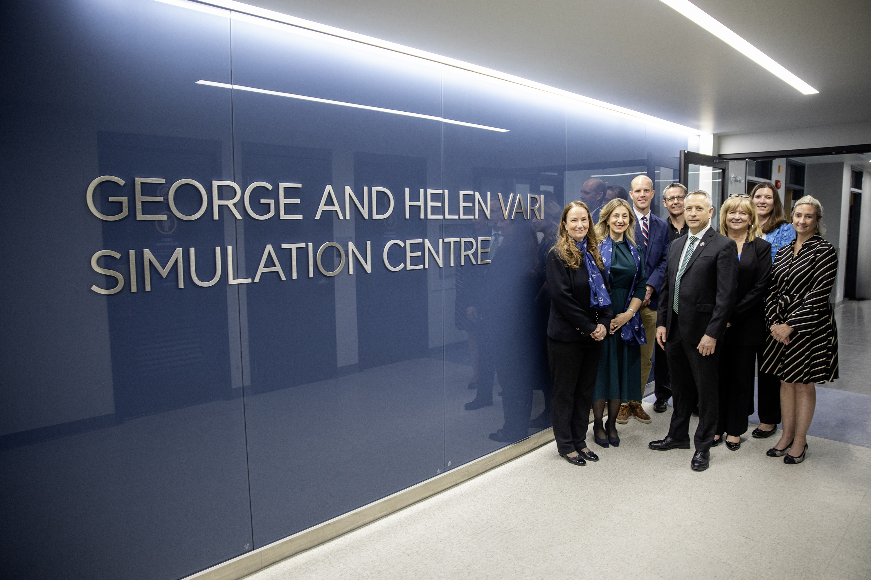 Group photo in front of George and Helen Vari Simulation Centre