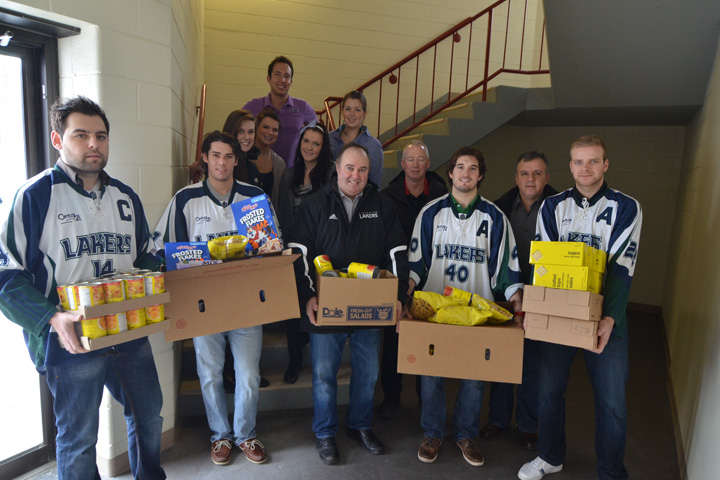 Group of Lakers Athletes show off their boxes of donations for the NUSU food bank