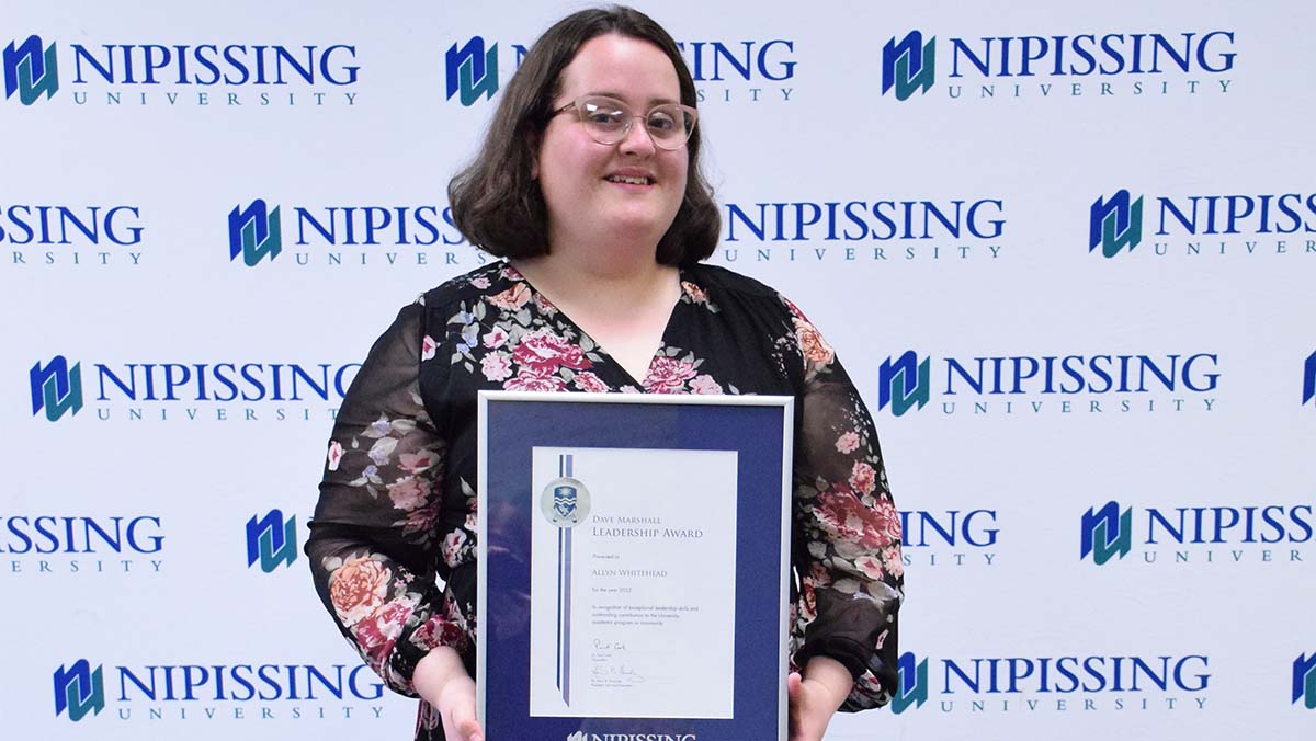 Allyn Whitehead with DMLA award
