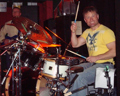 Photo of drummer holding up drumstick
