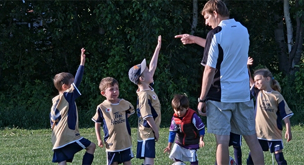 Dr. Mark Bruner coaching youth soccer