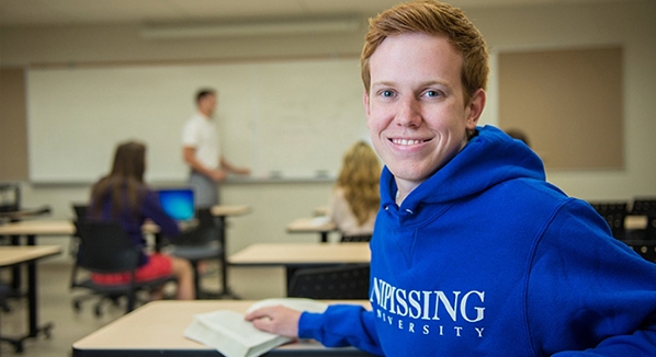 Happy student in class