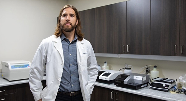 Dr. Steven Arnockyin his lab