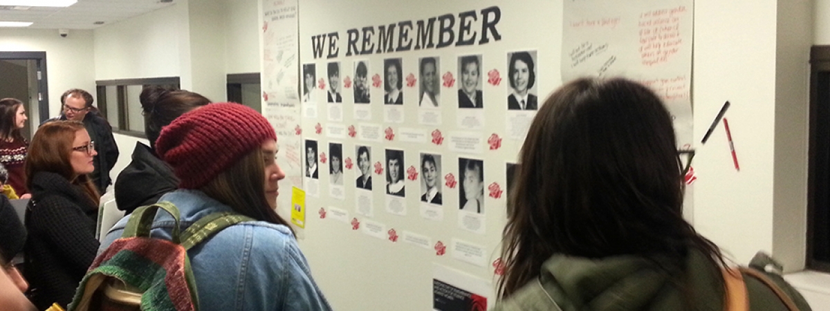 students looking at a memorial