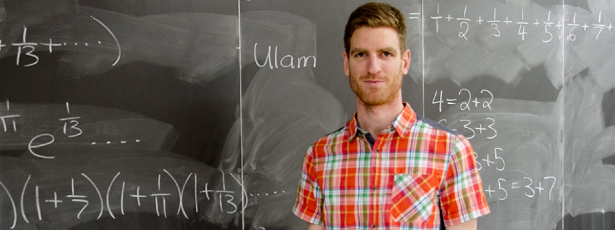 professor in front of chalkboard