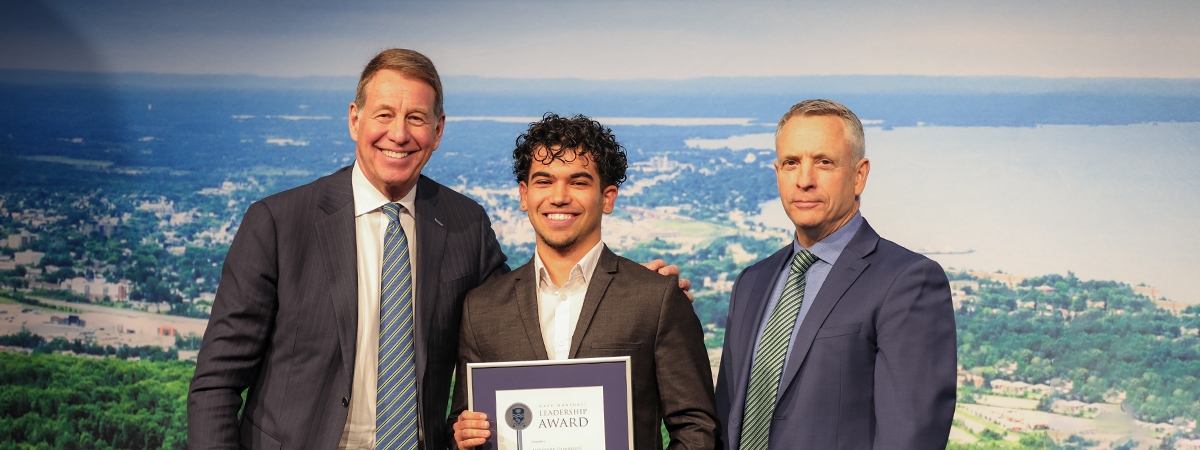 photo of Dr. Scott Russell, Chancellor of Nipissing University, Alexander Domingos, DMLA Recipient in the Campus category, and Dr. Kevin Wamsley, President and Vice-Chancellor of Nipissing University