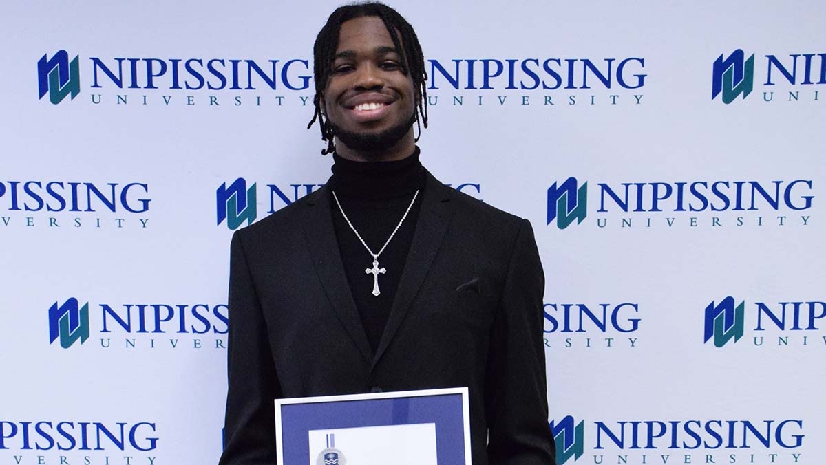 Taijon Eccleston-Graham with award