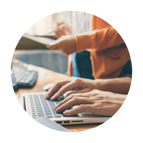 Individual working on a laptop pursuing professional development.