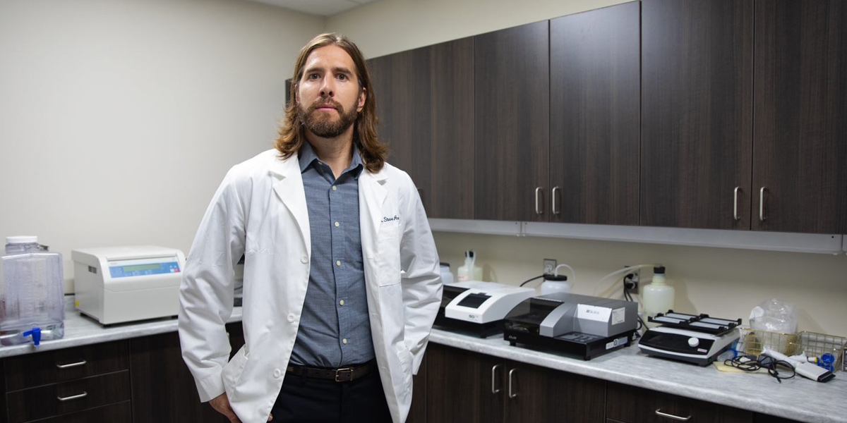 Dr. Steven Arnockyin his lab.