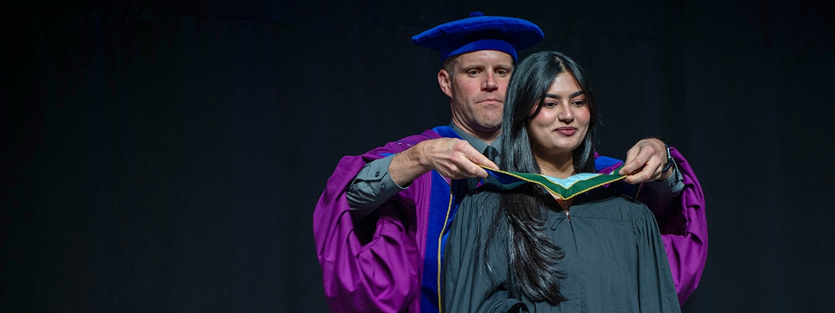 Graduand receives degree hood