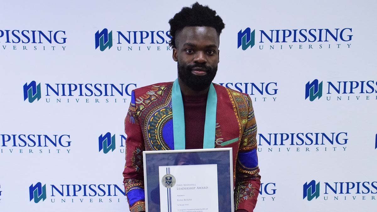 Elisa Butoyi with DMLA award