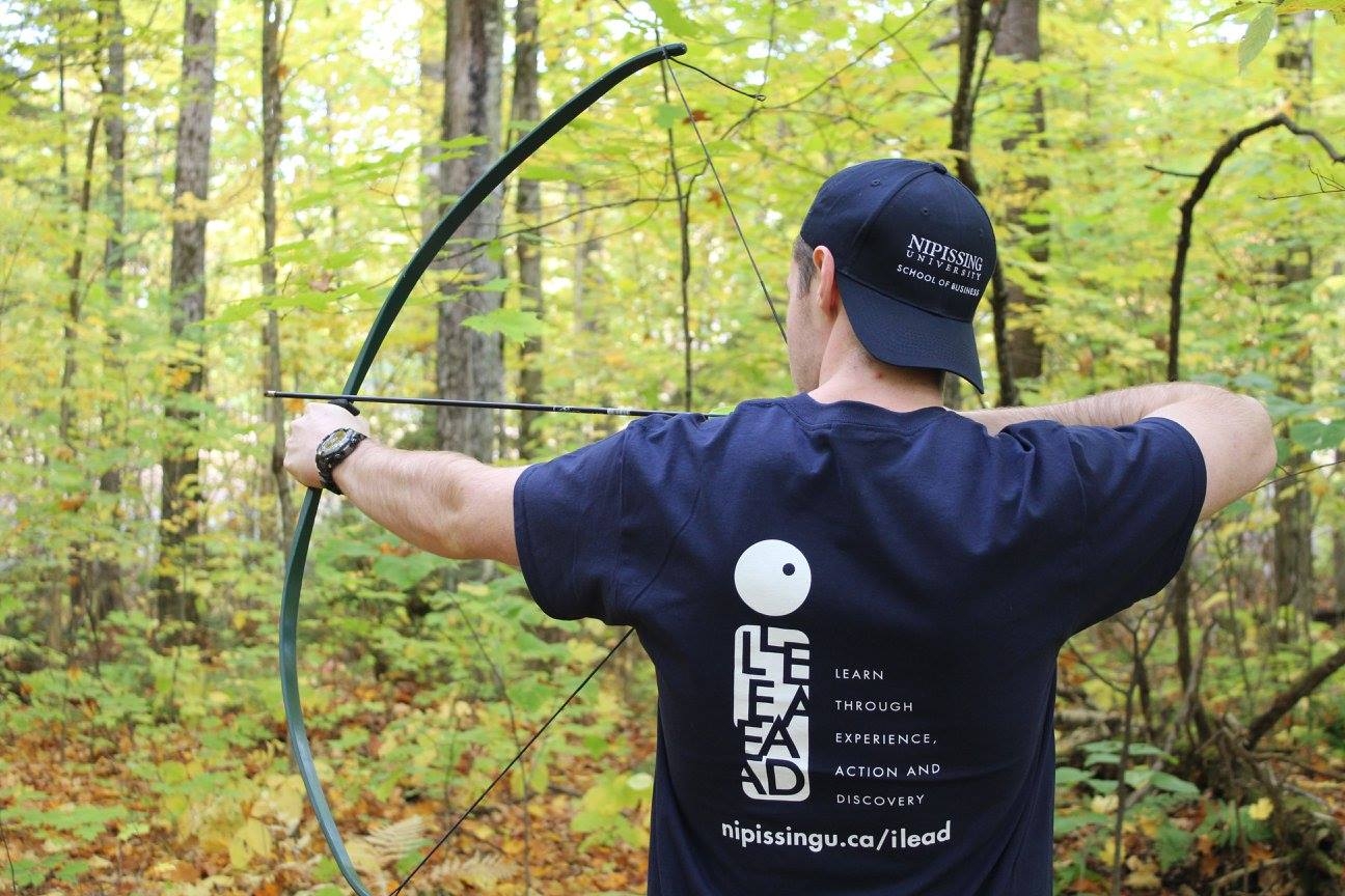 Photo of an archer holding a recurve bow
