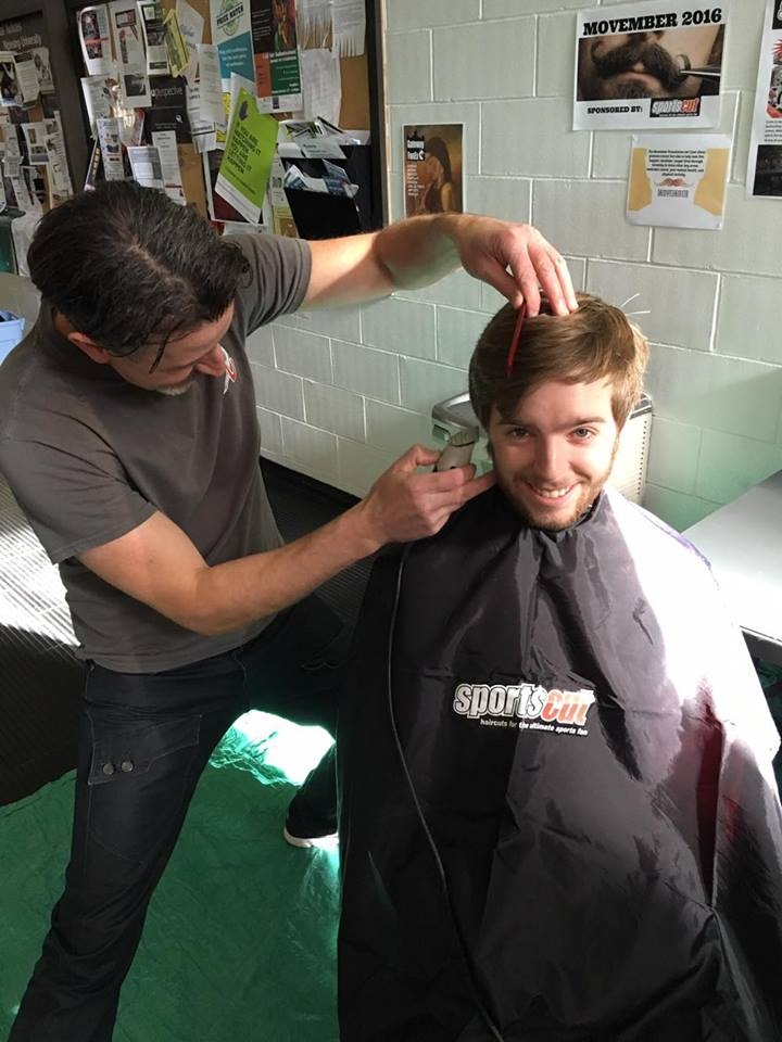 Photo of Marcus Hawco getting a haircut