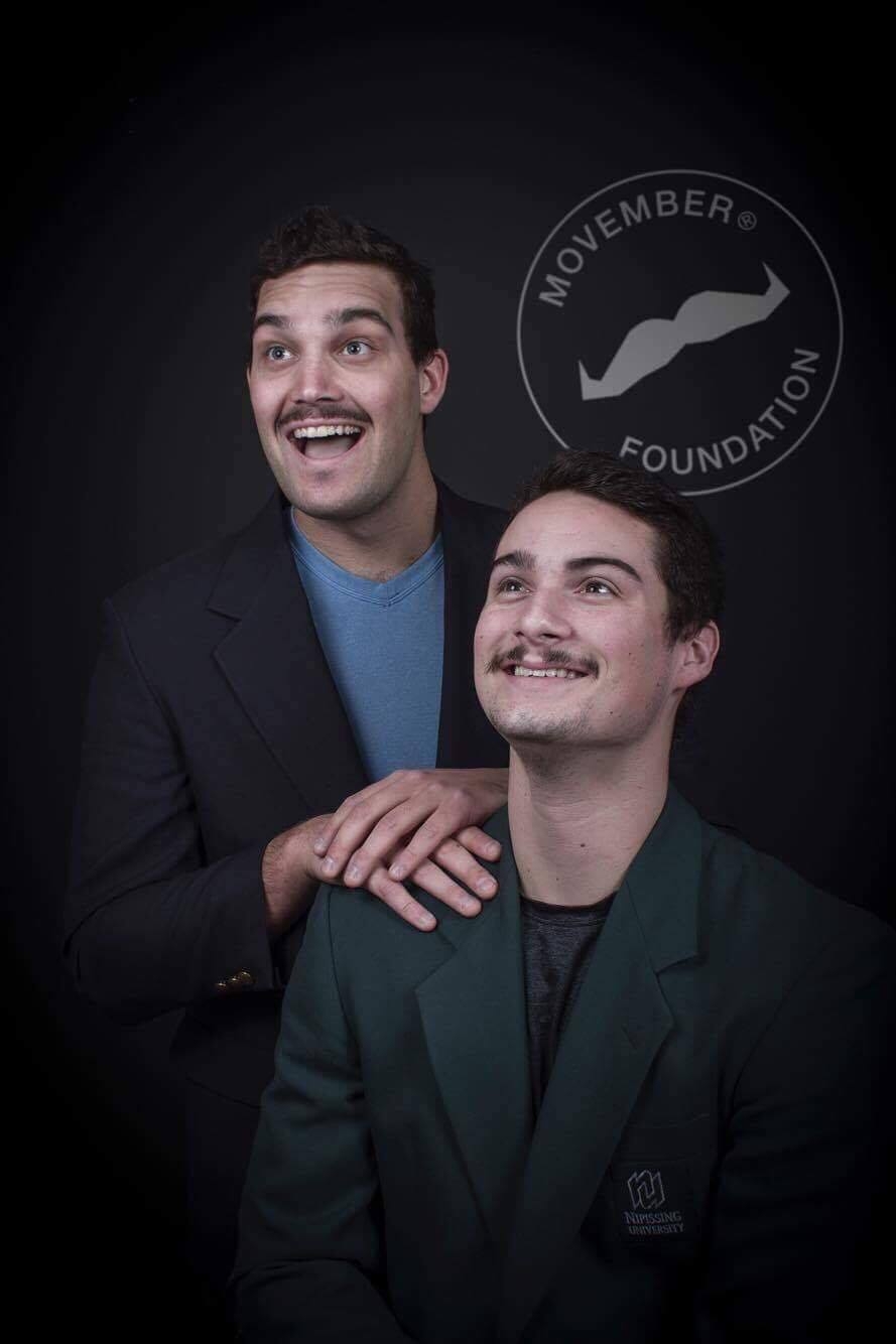 Photo of two men with moustaches