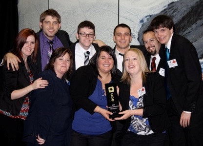 SIFE team with trophy