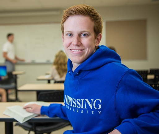 Happy student in class