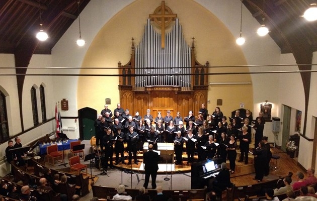 Photo of Near North Voices choir members performing in a church
