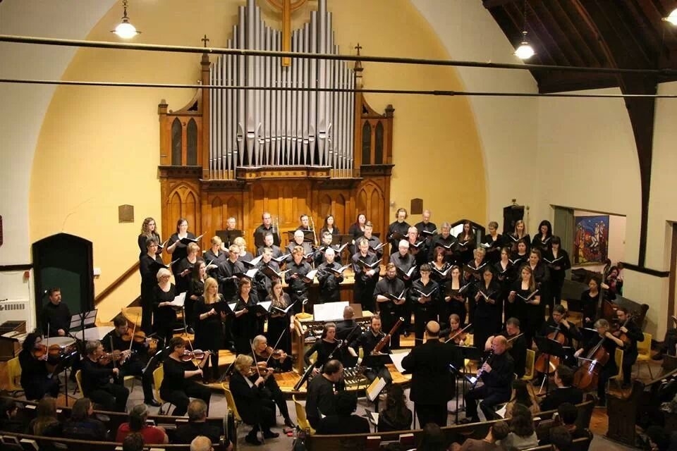 Photo of Near North Voices choir members performing in a church