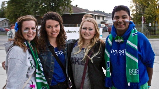 Students outside Memorial Gardens at Homecoming