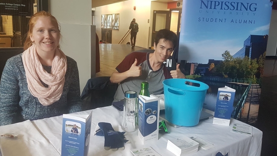 NUSA volunteers at a table in the Education Centre lobby