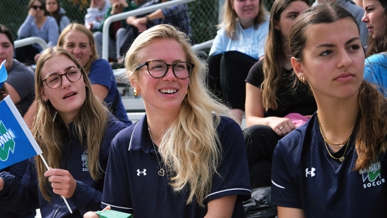 Student and alumni fans cheering on the Lakers during Homecoming weekend