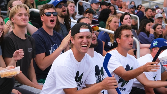 Student and alumni fans cheering on the Lakers during Homecoming weekend