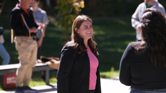 Laker smiling outdoors during NU Homecoming 2025