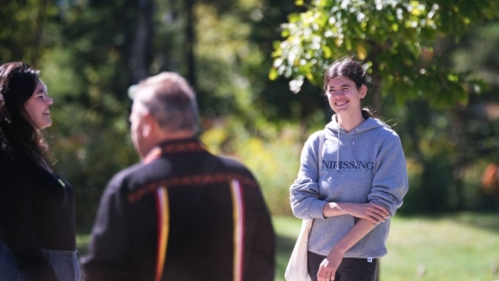 Lakers socializing outside during NU Homecoming 2025 Medicine Walk